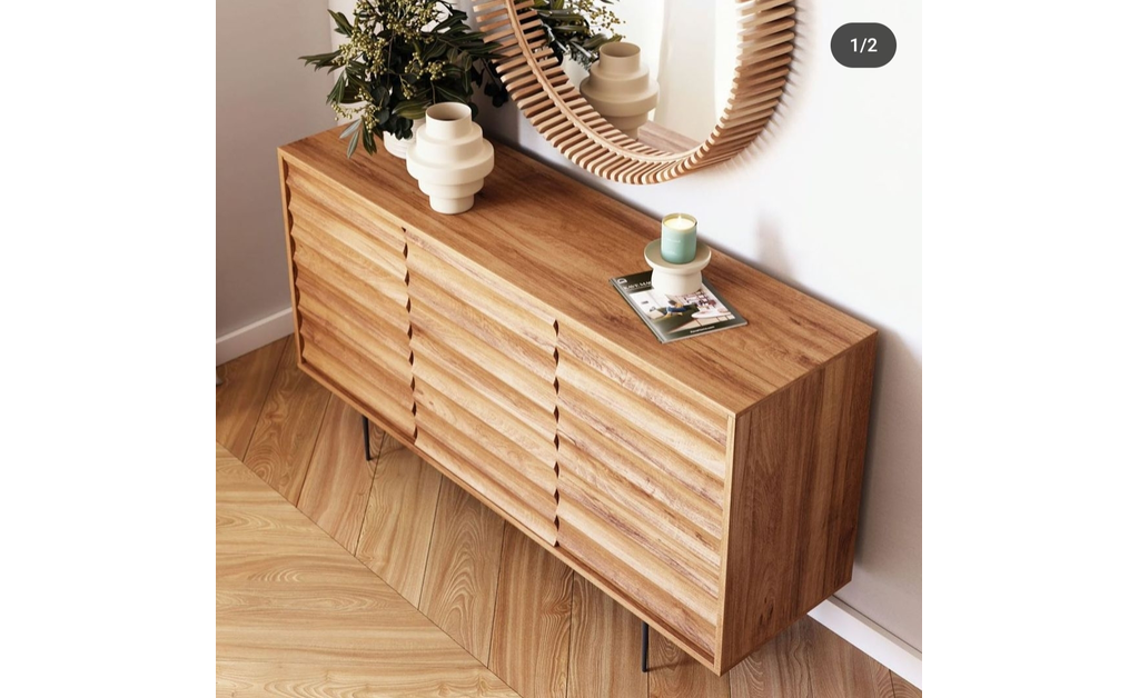 Japanese-style natural wood console with clean lines under a round mirror.