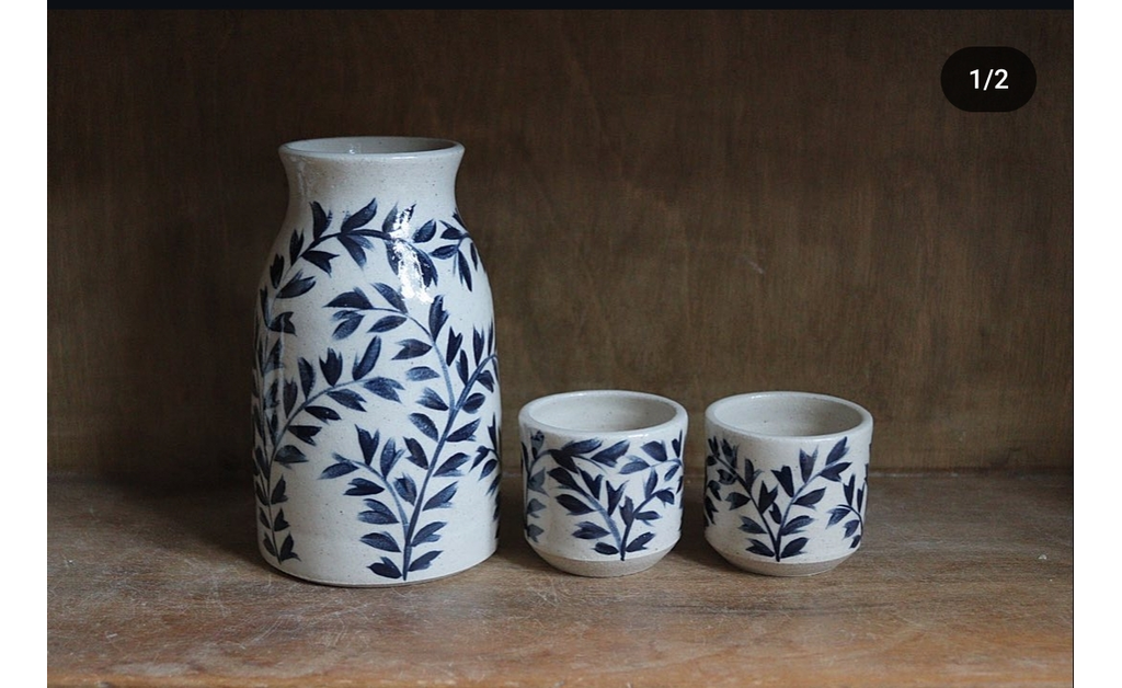 a white ceramic pottery(sake set).