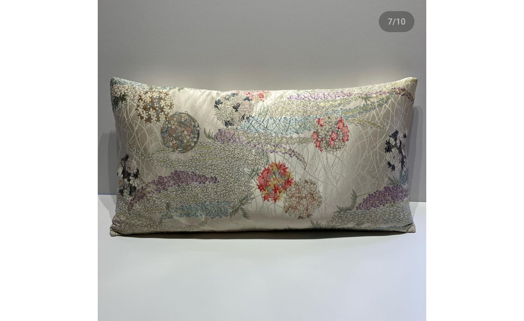 Off white silk cushion with a Japanese cultural print.