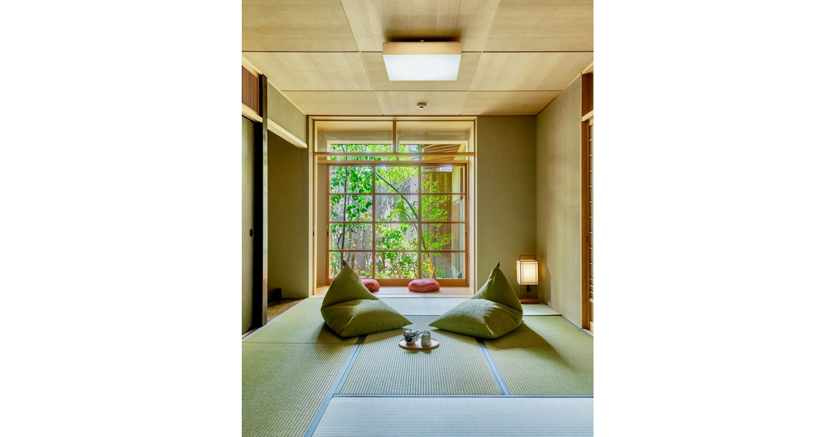 Two floor cushions placed on tatmi mats in a bright and airy japanese-style living room.